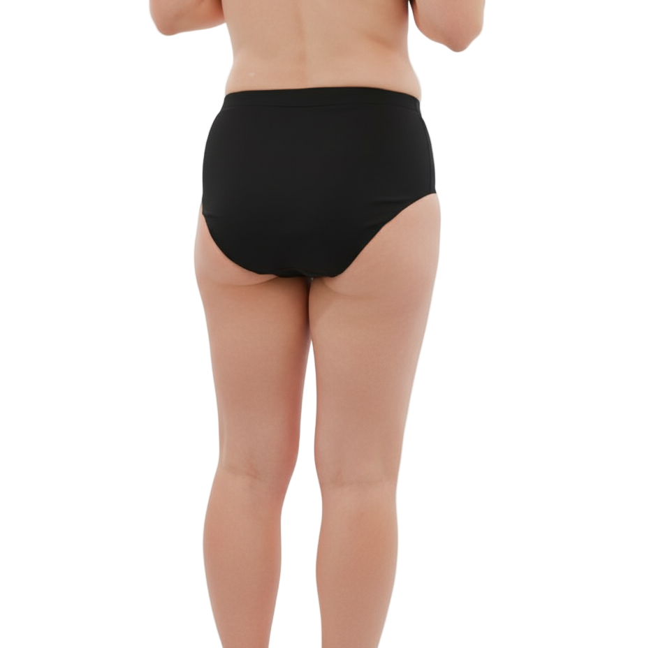 Person wearing black high-waisted underwear on a white background